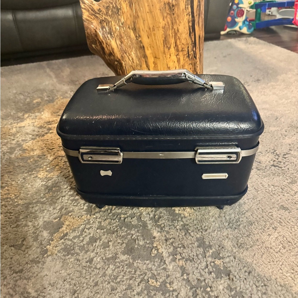 Vintage dark blue travel cosmetics case.